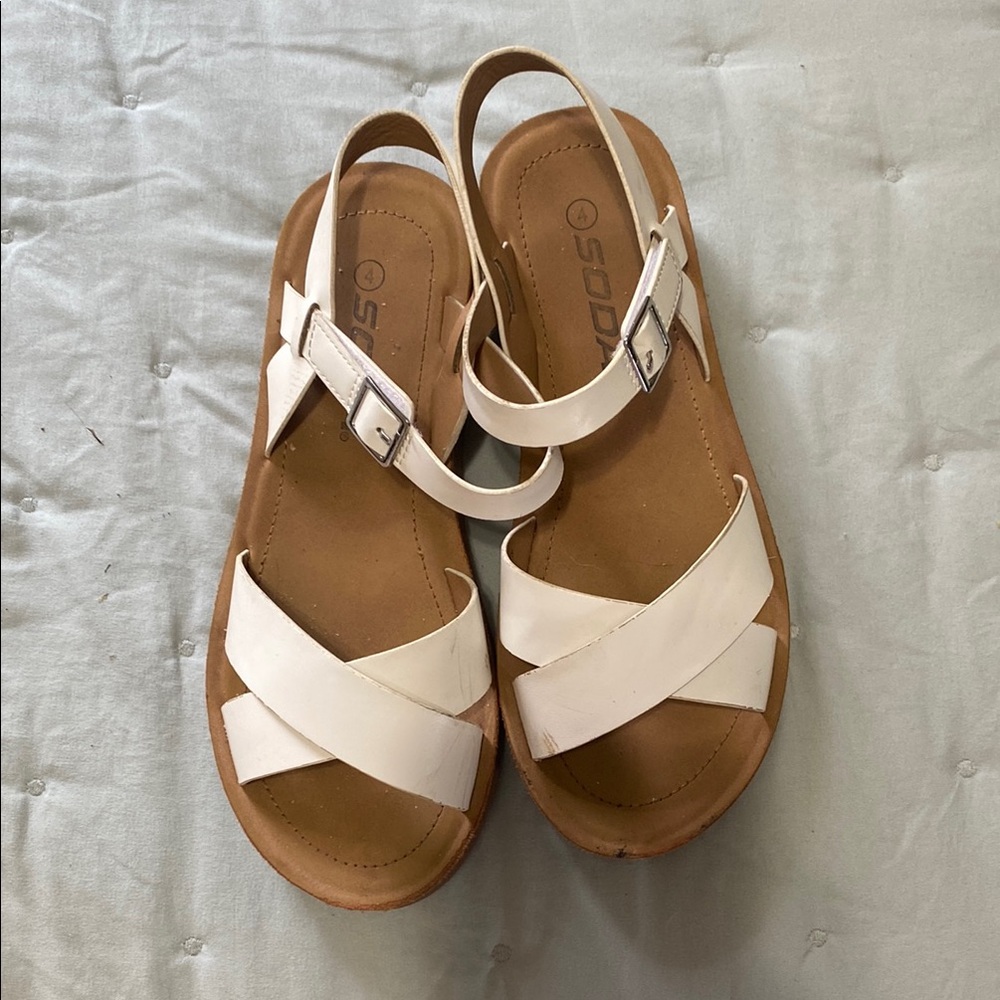 Old Navy pink flip flops and White Tan Sandals Crisscross Design